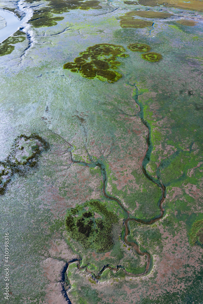 Aerial view at low tide of the Rio del Escudo and Marisma de Rubin, Oyambre Natural Park, San Vicente de la Barquera, Cantabrian Sea, Cantabria, Spain, Europe Aerial view at low tide of the Rio del Escudo and Marisma de Rubin, Oyambre Natural Park, San Vicente de la Barquera, Cantabrian Sea, Cantabria, Spain, Europe