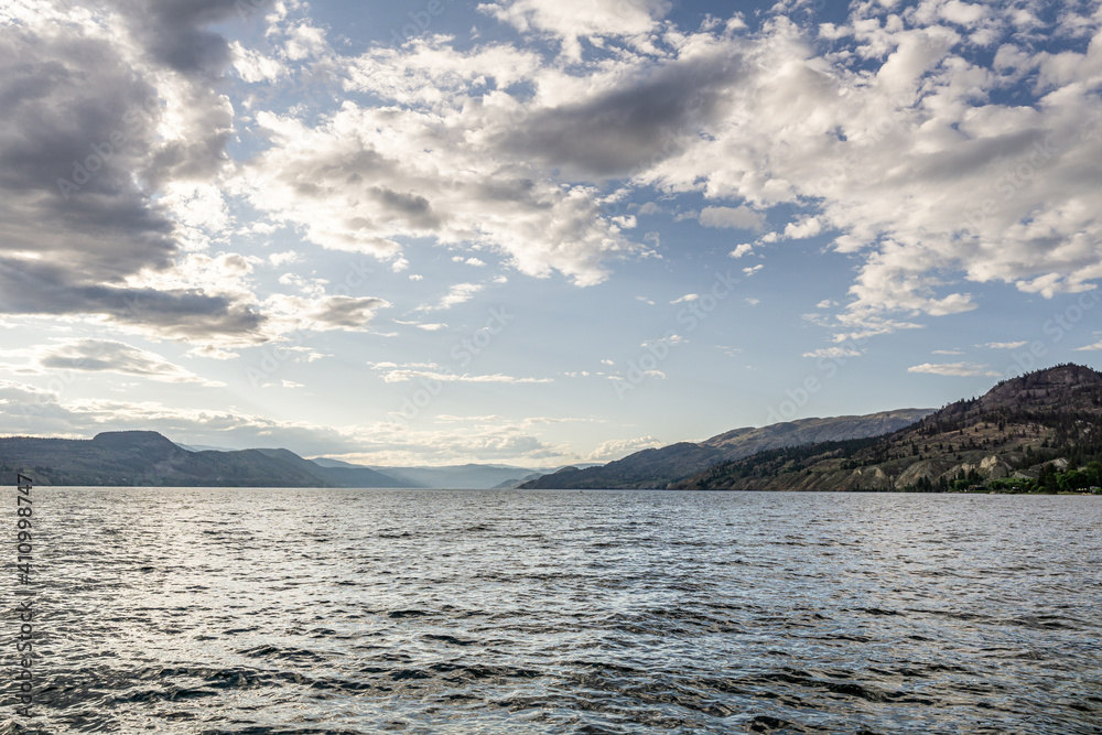 beautiful Okanagan lake with blue sky and white clouds summer day.