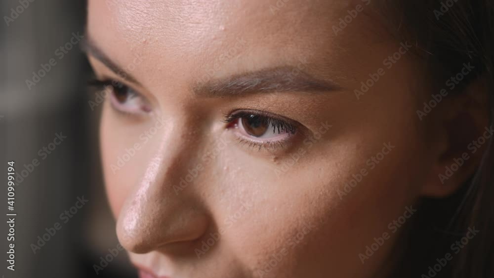 Closeup of Woman Face, woman has beautiful brown Eyes. Natural Beauty. Gorgeous woman with long Eyelashes and Attractive Appearance. Slow motion. Closeup of Woman Face, woman has beautiful brown Eyes. Natural Beauty. Gorgeous woman with long Eyelashes and Attractive Appearance. Slow motion.