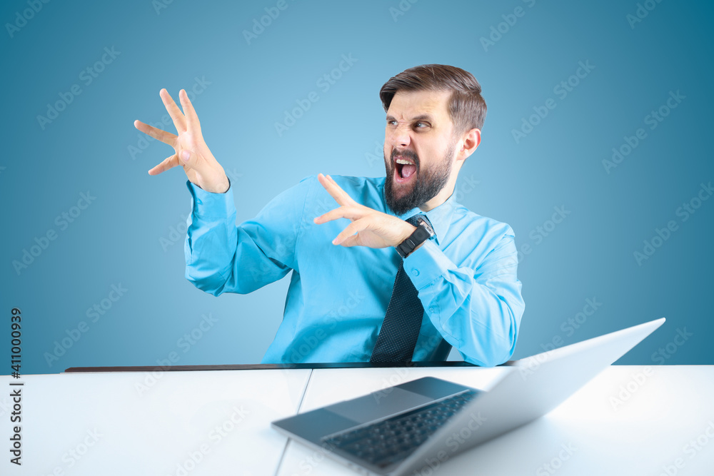 the bearded businessman at the computer opened his mouth and gestured with his hands to the side the bearded businessman at the computer opened his mouth and gestured with his hands to the side
