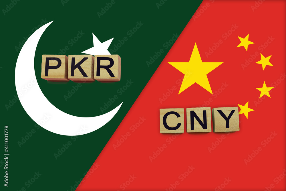 Pakistan and China currencies codes on national flags background Pakistan and China currencies codes on national flags background