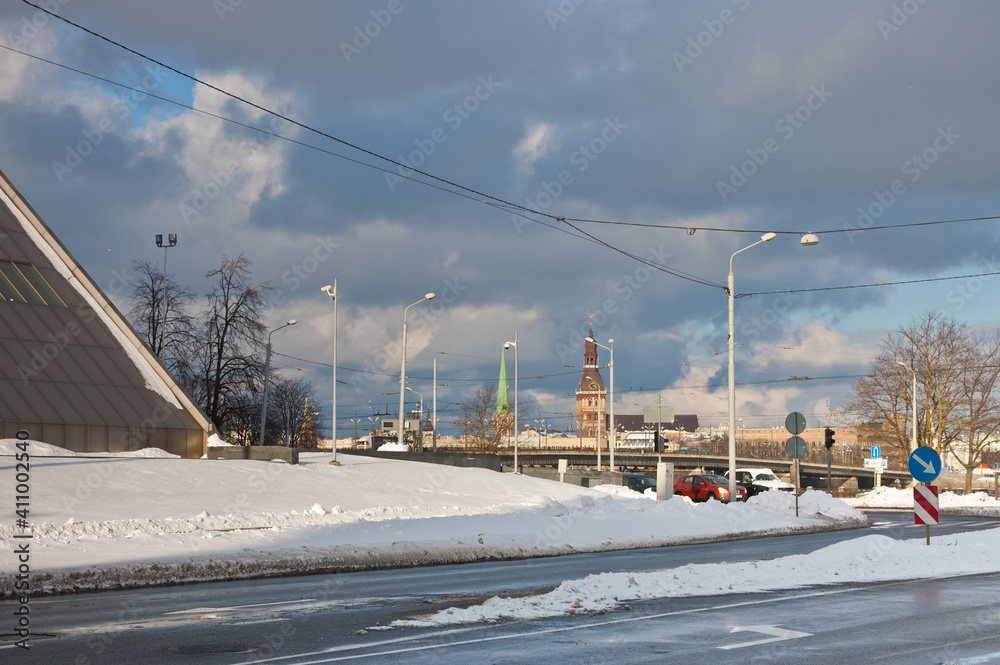 riga, city panorama, road and snow in the foreground