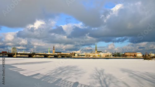 riga, city panorama, frozen river and snow in the foreground