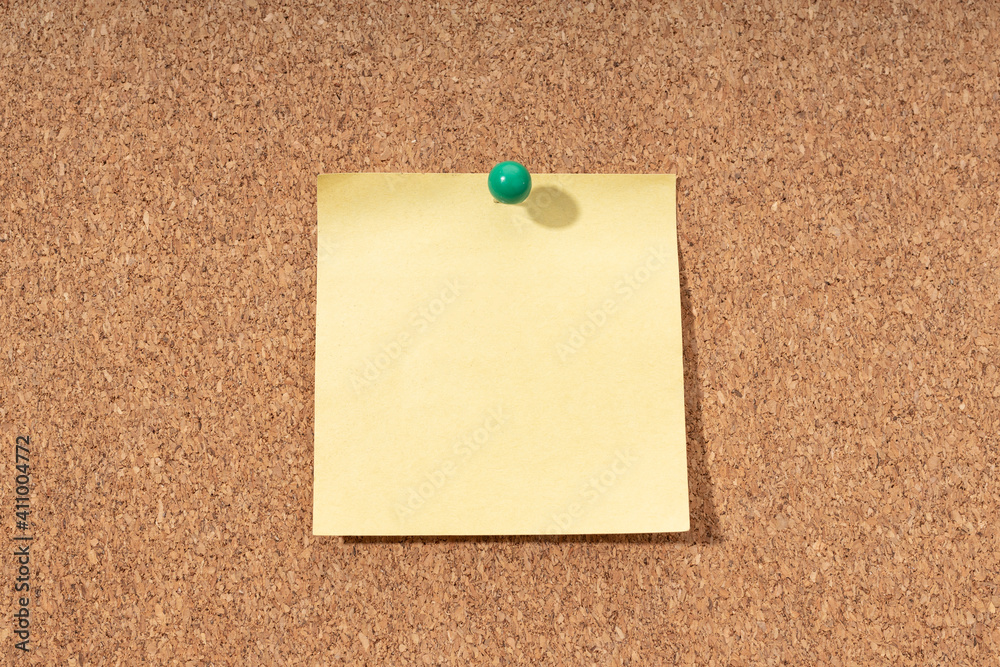 Cork board with blank yellow note for adding text. Mock up Cork board with blank yellow note for adding text. Mock up