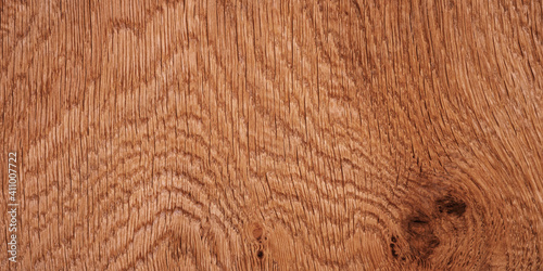 Light brown wood texture with knots.