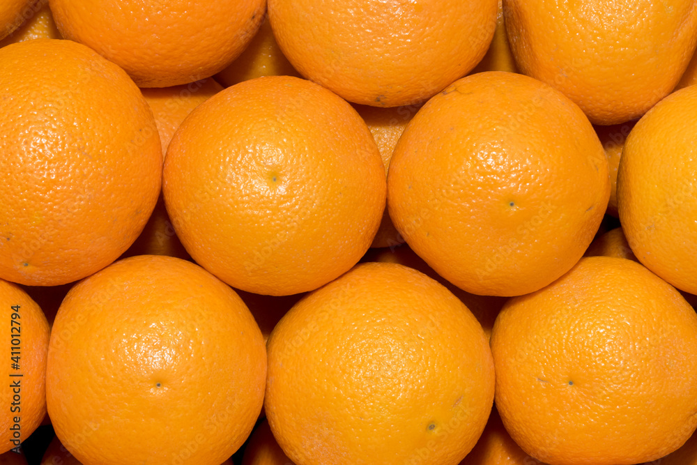 Rows of oranges at the market as background Rows of oranges at the market as background