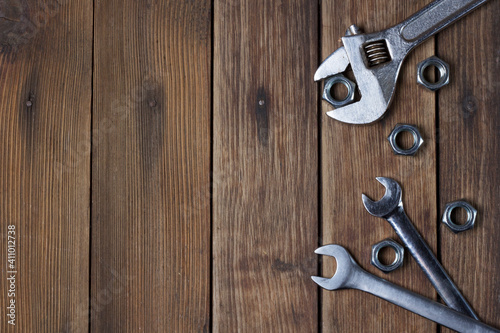Set of two Wrenches on wooden plank background