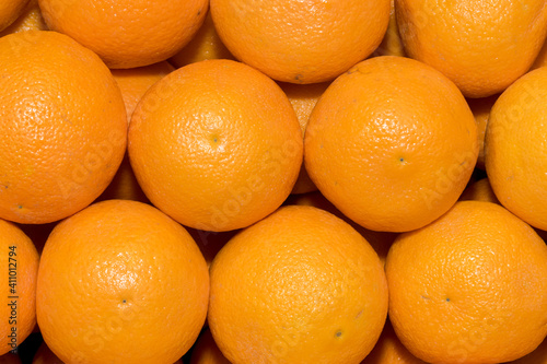 Rows of oranges at the market as background