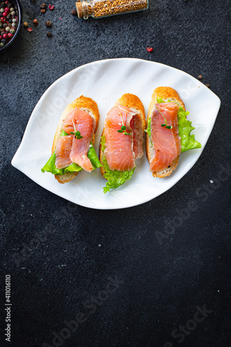 salmon sandwich fish Smorrebrod bruschetta seafood on the table for healthy meal snack top view copy space for text food background pescetarian