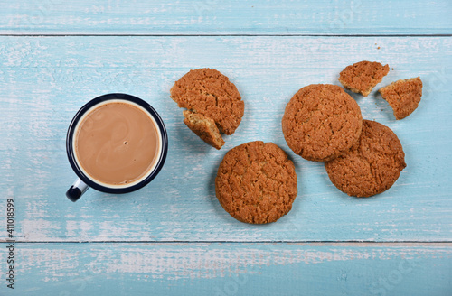Oatmeal cookies and pannikin of hot chocolate photo