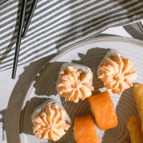 Sushi set and chopsticks on napkin