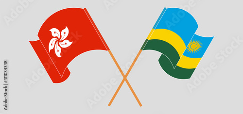 Crossed and waving flags of Hong Kong and Rwanda