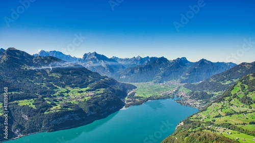 fantastic view from amden over lake walen with a view of the small village of weesen and the mountains of glarus
