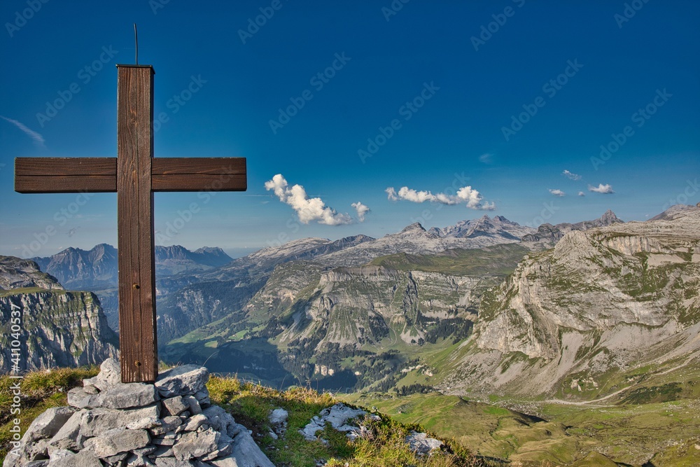 summit cross at raustoeckli klausenpass in canton of glarus and schwyz. fantastic foresight to the swiss mountains summit cross at raustoeckli klausenpass in canton of glarus and schwyz. fantastic foresight to the swiss mountains