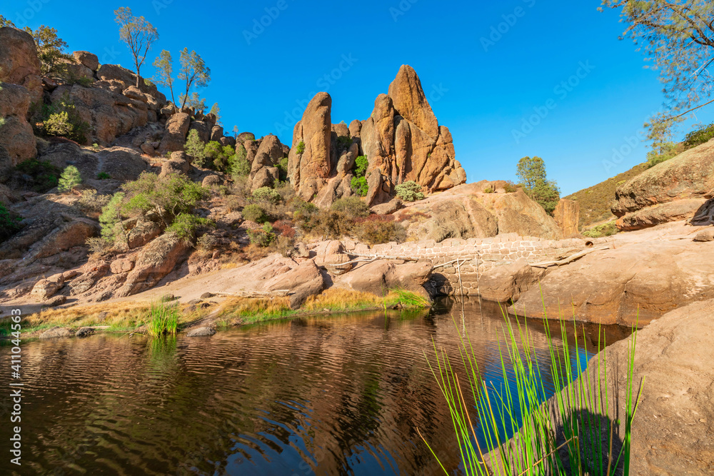 Lake Bear Gulch and rock formations in Pinnacles National Park in California, the ruined remains of an extinct volcano on the San Andreas Fault. Beautiful landscapes, cozy hiking trails for tourists