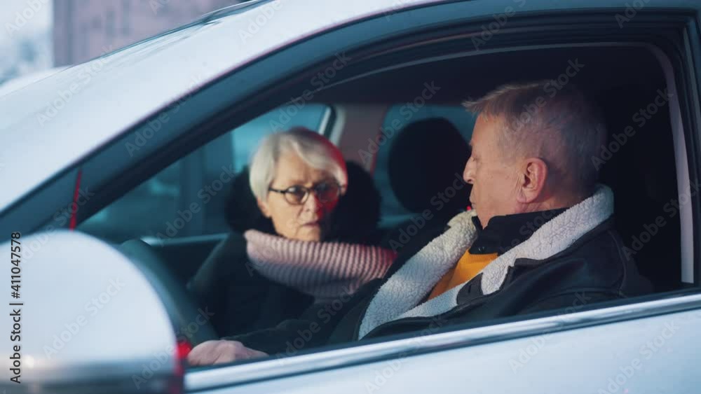 Elderly couple looking at each other in shock realising there is police behind their car. High quality 4k footage Elderly couple looking at each other in shock realising there is police behind their car. High quality 4k footage