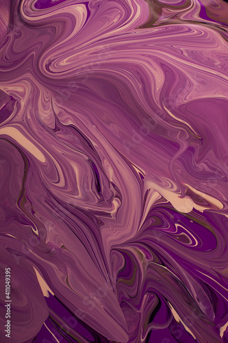 Abstract violet colors background.Make up concept.Beautiful stains of liquid nail laquers.Fluid art pour painting technique.Good as digital decor for phone copy space.Vertical photography.