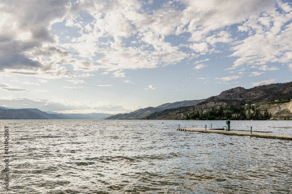 beautiful Okanagan lake with blue sky and white clouds summer day.