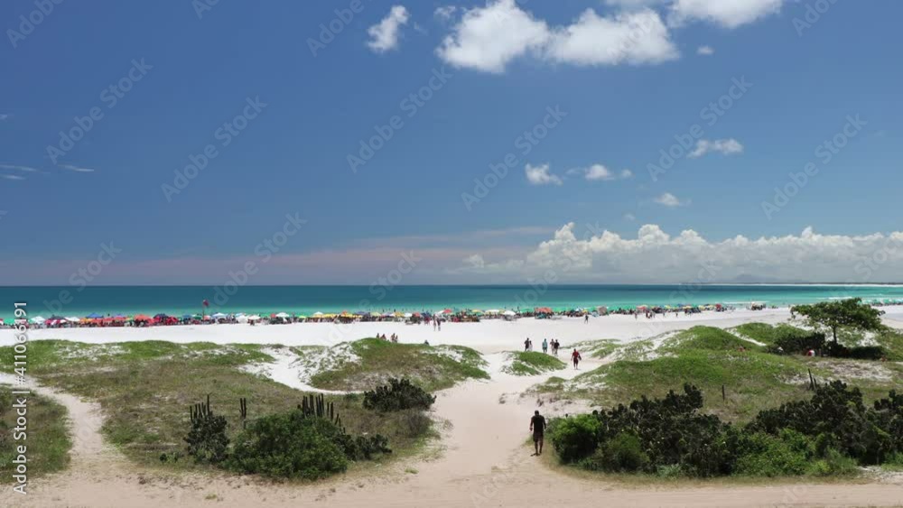 Time lapse: Sunny morning with crowded beach Time lapse: Sunny morning with crowded beach