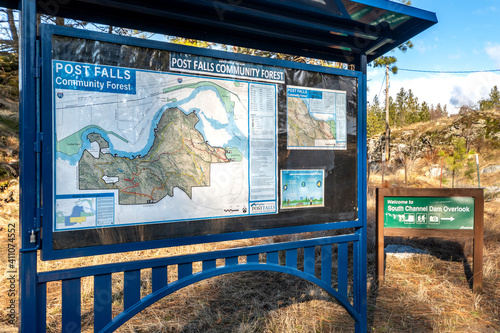 The welcome sign to Post Falls Community Forest near the Post Falls Dam with signs to the walking trail in Post Falls, Idaho, USA photo