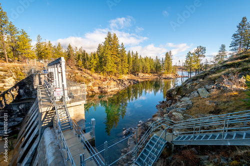 The Spokane River as it backs up against the Post Falls Dam in the Post Falls Community Forest and park area in Post Falls, Idaho, USA.