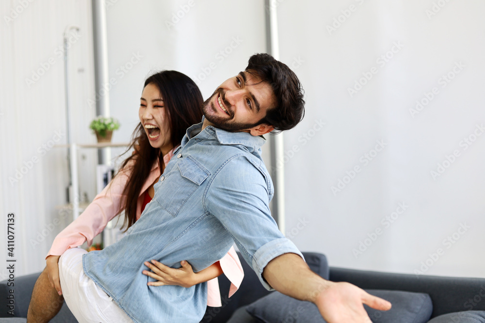 Happiness young couple having fun and dancing for stay home from protection corona virus.