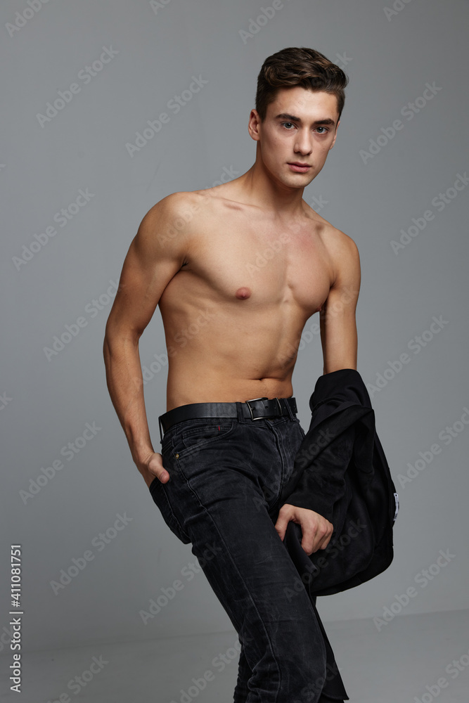 Cute man nude torso black shirt fashion attractiveness gray background Cute man nude torso black shirt fashion attractiveness gray background