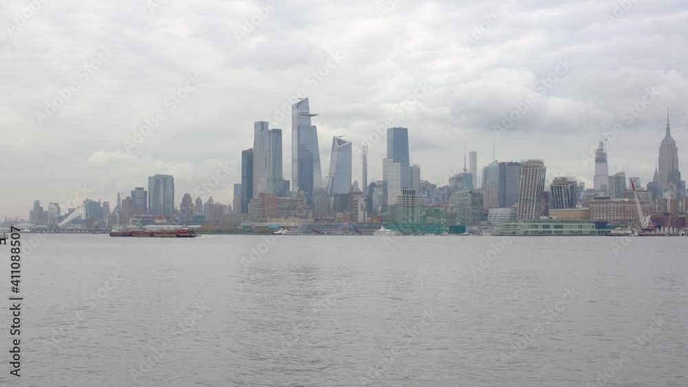 New York and Hudson Yards with Empire State Building seen from Hoboken over the Hudson River to Manhattan