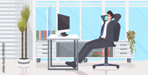 businessman sitting at workplace desk social distancing coronavirus epidemic protection self isolation remote work concept office interior horizontal full length vector illustration