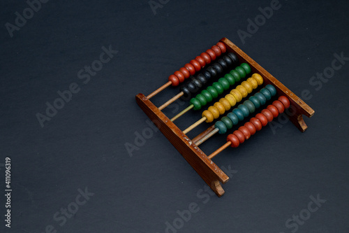 The abacus  also known as abacus or abacus  is a calculating tool for performing arithmetic processes. Isolated on black background.