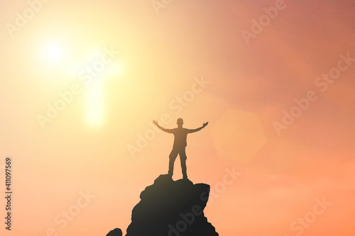 One man Praying for blessings from god During the sunset in the sky the symbol of the cross appeared. Make him feel hopeful And more encouragement