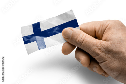 Wallpaper Mural Hand holding a card with a national flag the Finland