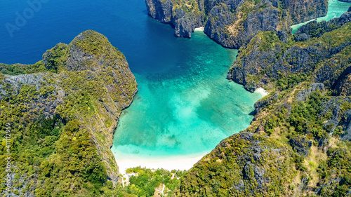 Aerial drone view of tropical Ko Phi Phi island, beaches and boats in blue clear Andaman sea water from above, beautiful archipelago islands of Krabi, Thailand 