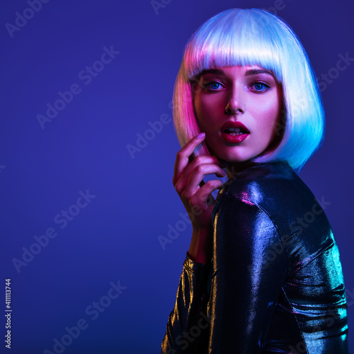 Glamour fashion girl. Beauty face with bright makeup. Young beautiful woman in a white wig, bob hairstyle. Close up art portrait of an young attractive woman with vivid colors. Stylish blonde.