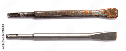 Schilderij op canvas two a chisel from a perforator is isolated on white background
