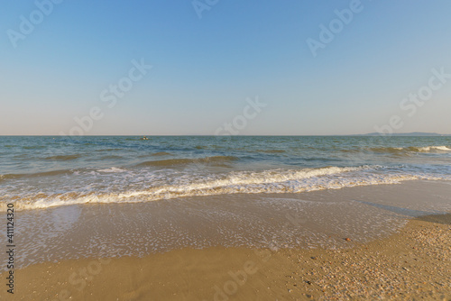 Empty beach against blue clear sky