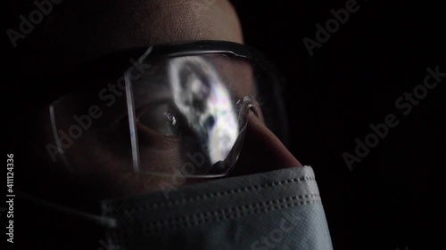 Head and Brain MRI Scan Analysed by Doctor Radiologist Wearing Glasses and Mask