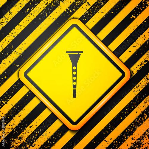 Black Clarinet icon isolated on yellow background. Musical instrument. Warning sign. Vector.