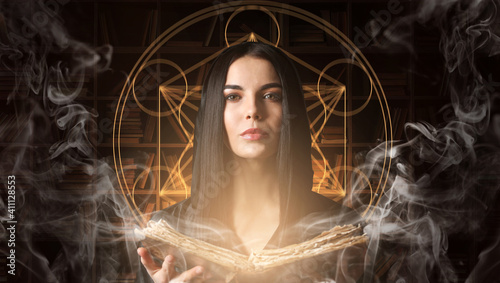 Female alchemist with book ...