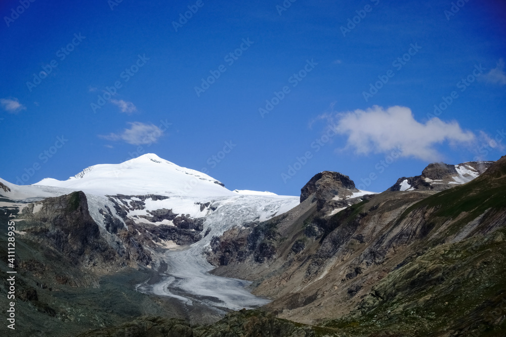 wonderful mountain landscape with a glacier and blue sky