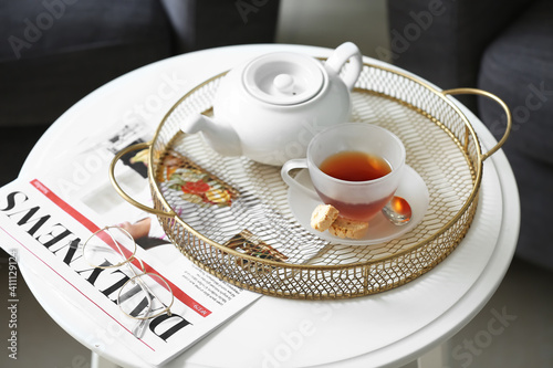 Tray with teapot and cup on...