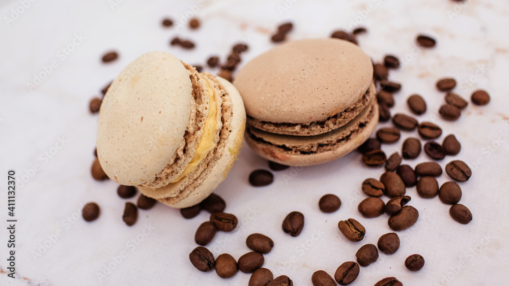 sweet chocolate macaroons with coffee beans. Sweet dessert for tea. Sweets as a gift, a place for text, a place for copying, a banner sweet chocolate macaroons with coffee beans. Sweet dessert for tea. Sweets as a gift, a place for text, a place for copying, a banner