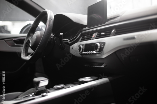 interior of a modern car. Steering wheel, seat, radio, screen. © Make_story Studio