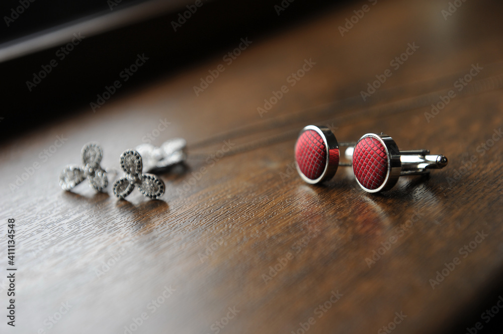 Detail of buttons placed on a solid wood surface. Detail of buttons placed on a solid wood surface.