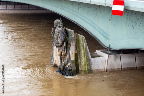 Famous Zouave statue of Pont de Alma during Seine river flood in Paris, France (by Georges Diebolt 1816-1861) . The statue is used as an informal flood marker for the level of the River Seine in Paris photo