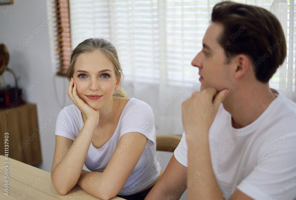 The young couple is consulting and planning their life after corona virus stop. The young couple is consulting and planning their life after corona virus stop.