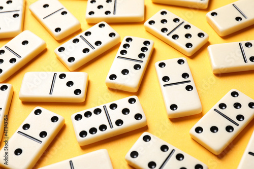 Set of classic domino tiles on yellow background