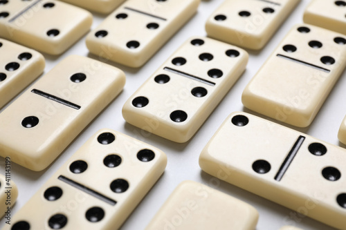 Classic domino tiles on white background  closeup