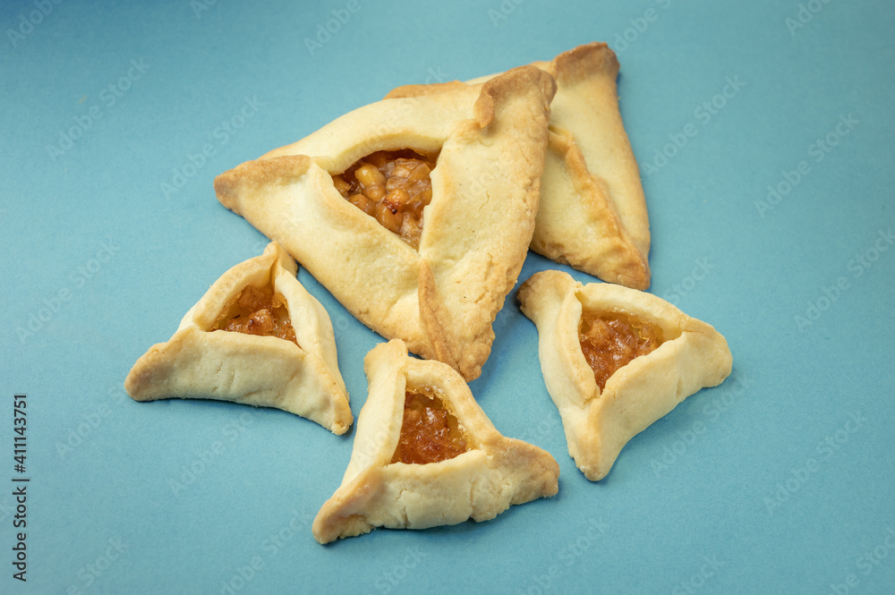Close up of Hamantaschen cookies or hamans ears for Purim celebration (Jewish carnival holiday). Selective focus. Close up of Hamantaschen cookies or hamans ears for Purim celebration (Jewish carnival holiday). Selective focus.