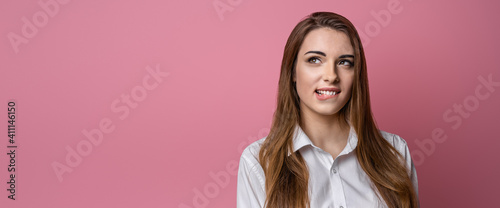 Photo of thoughtful attractive brunette girl biting lip waiting news